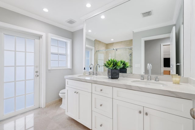 bathroom featuring a shower with door, vanity, ornamental molding, and toilet