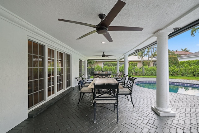 view of patio featuring ceiling fan