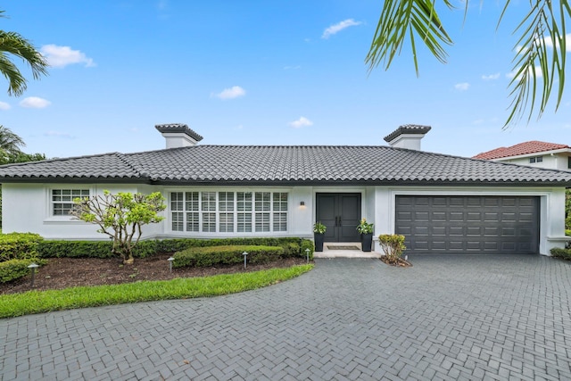 view of front of home with a garage