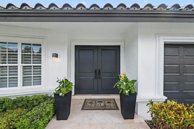 entrance to property featuring french doors