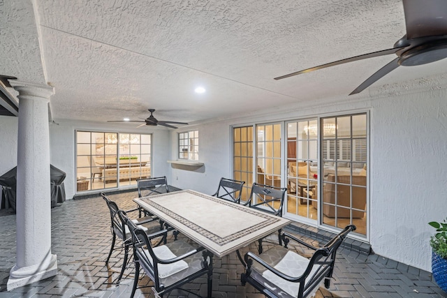 view of patio featuring ceiling fan