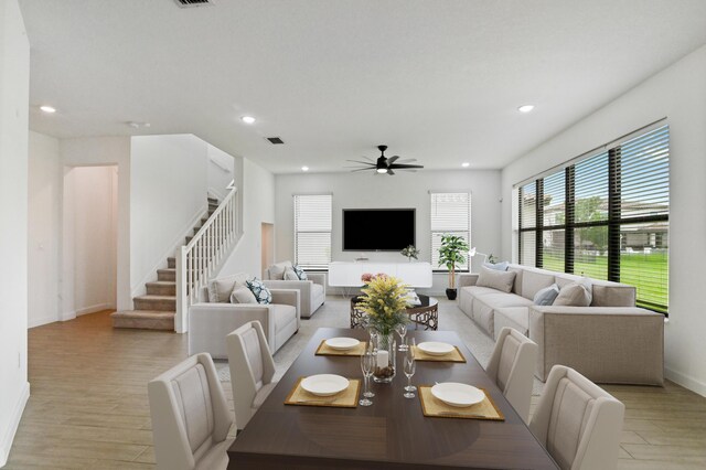 dining room featuring ceiling fan and light hardwood / wood-style flooring