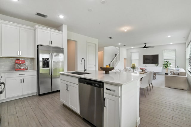 kitchen featuring white cabinetry, sink, and stainless steel appliances