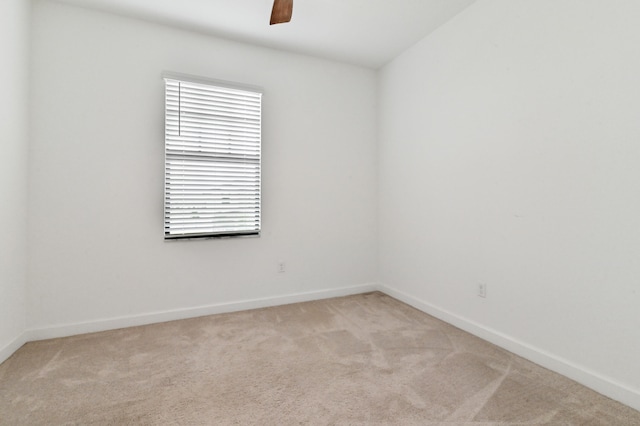 empty room with light carpet and ceiling fan