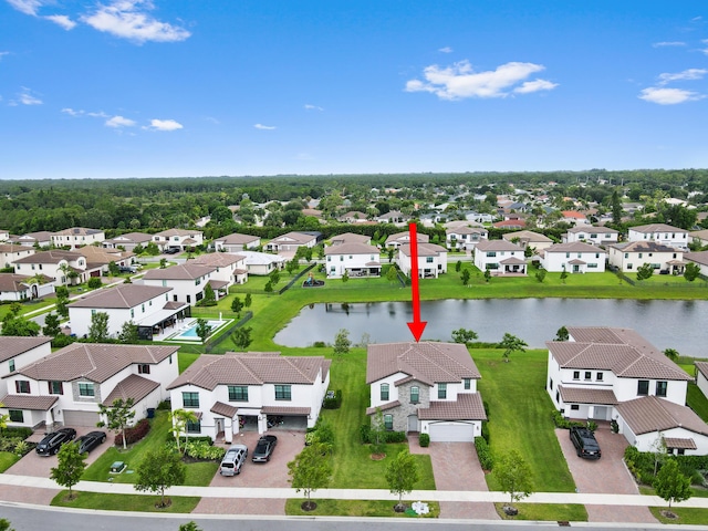 bird's eye view featuring a residential view and a water view