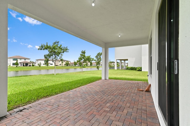 view of patio / terrace with a water view