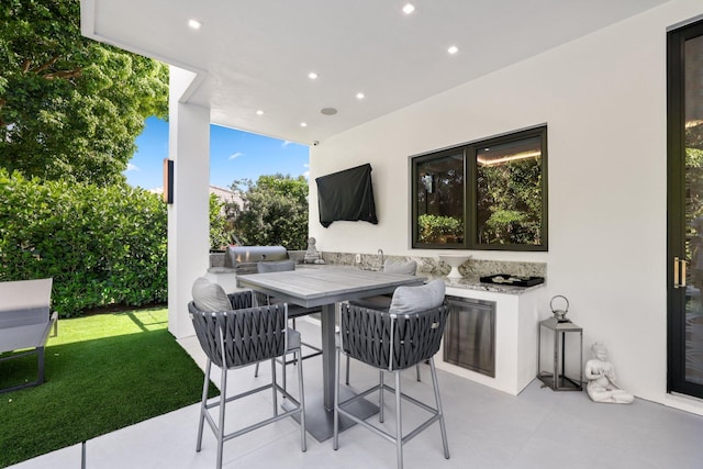 view of patio featuring exterior kitchen