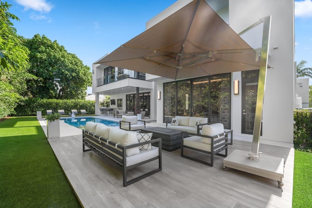 view of patio with a balcony and an outdoor hangout area