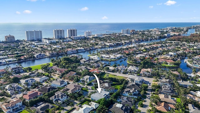 birds eye view of property with a water view