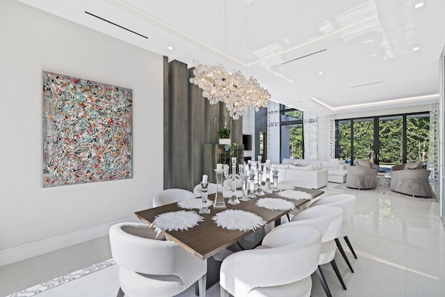 tiled dining room featuring a chandelier