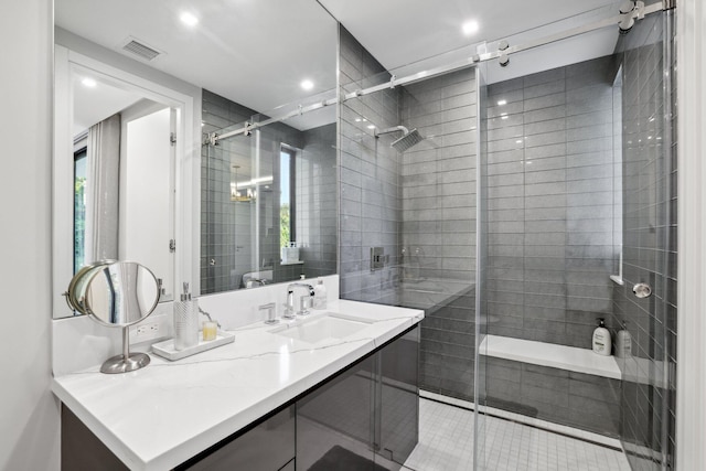 bathroom featuring vanity and a shower with shower door