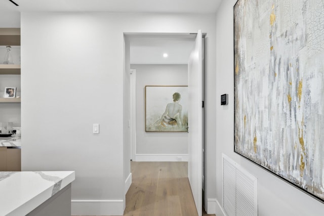 bathroom with hardwood / wood-style floors