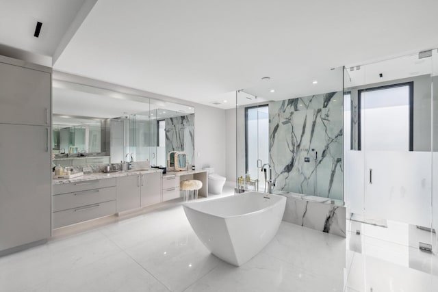 full bathroom featuring a wealth of natural light, vanity, tile walls, and shower with separate bathtub