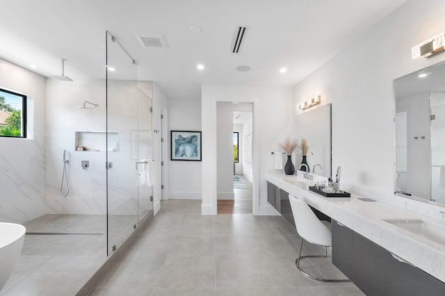 bathroom featuring shower with separate bathtub, tile flooring, and double sink vanity