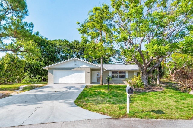 ranch-style home with a garage and a front lawn