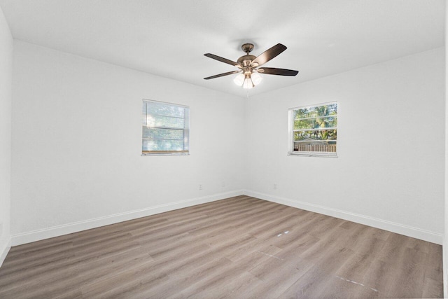 spare room with ceiling fan and light hardwood / wood-style flooring