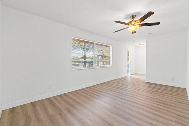 unfurnished room with ceiling fan and light hardwood / wood-style flooring