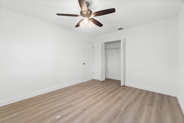 unfurnished bedroom with ceiling fan and light hardwood / wood-style floors