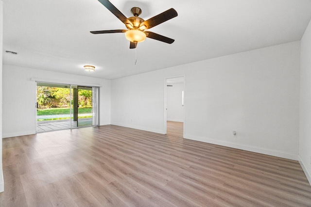 empty room featuring ceiling fan and light hardwood / wood-style flooring