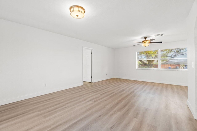 spare room featuring ceiling fan and light wood-type flooring