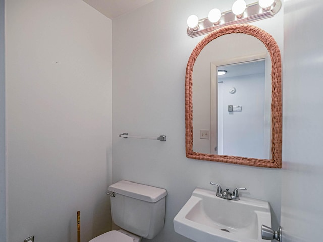 bathroom featuring sink and toilet