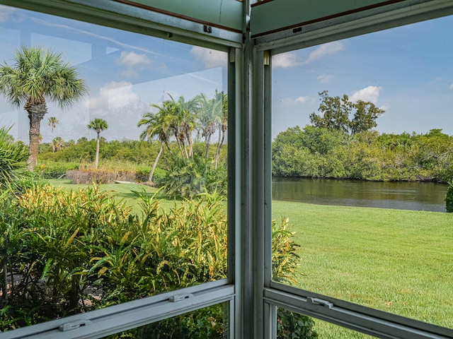 unfurnished sunroom with a water view