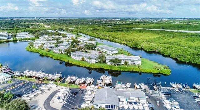 birds eye view of property featuring a water view