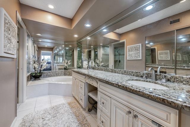 bathroom featuring vanity, separate shower and tub, and tile patterned floors