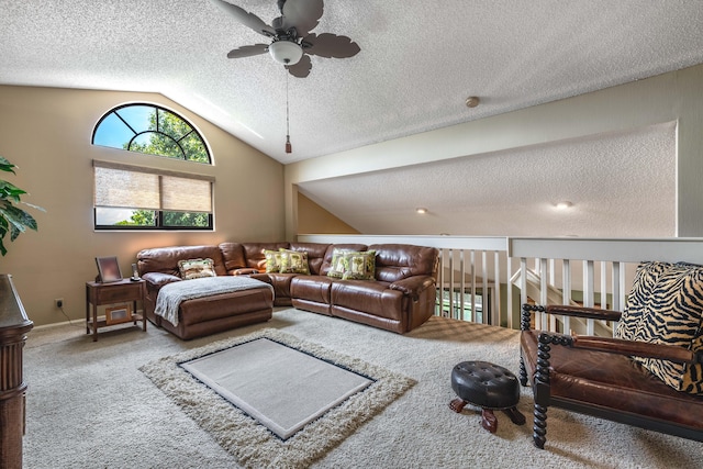 carpeted living room with lofted ceiling, ceiling fan, and a textured ceiling