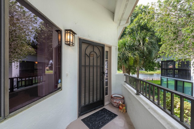 doorway to property featuring a balcony