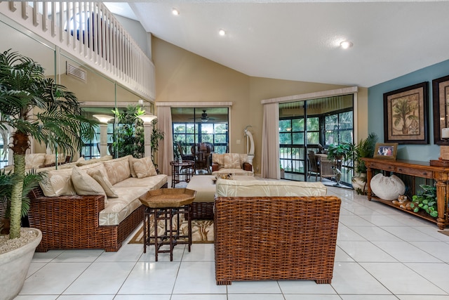 tiled living room with high vaulted ceiling and ceiling fan