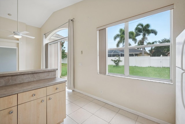 kitchen featuring light tile patterned floors, plenty of natural light, and ceiling fan