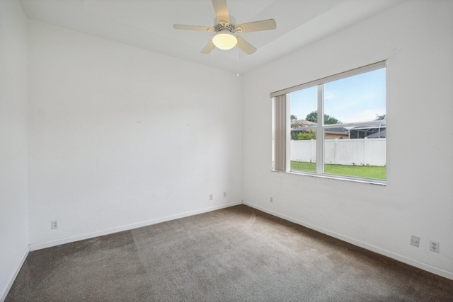 carpeted empty room with ceiling fan