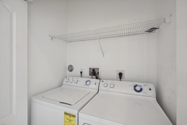 laundry room with washer and dryer