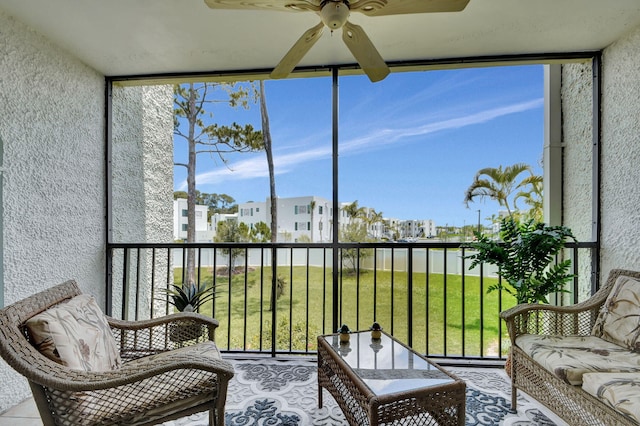 sunroom with ceiling fan and a healthy amount of sunlight