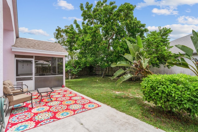 view of patio featuring a sunroom