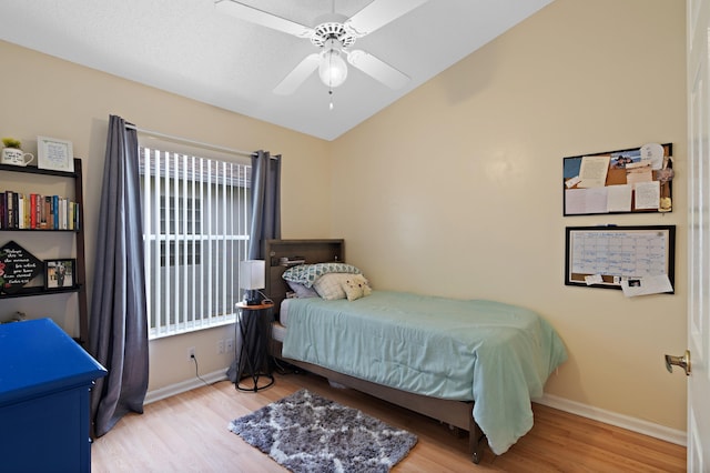 bedroom with ceiling fan and light wood-type flooring