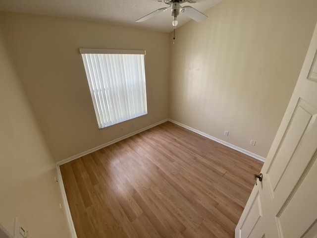 unfurnished bedroom featuring ceiling fan and light wood-type flooring