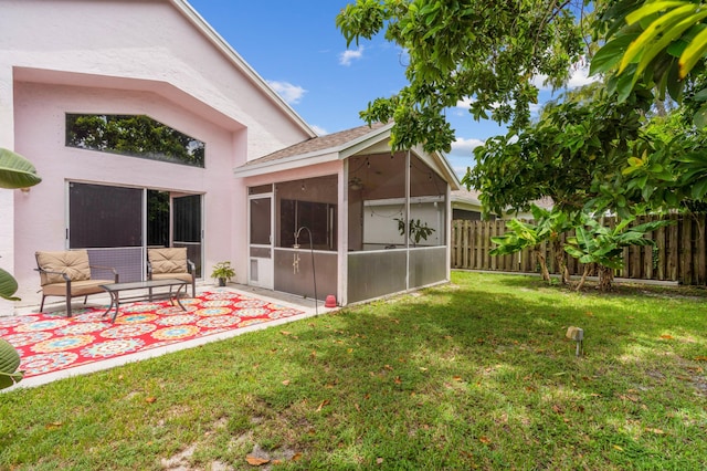 view of yard featuring an outdoor hangout area, a patio area, and a sunroom