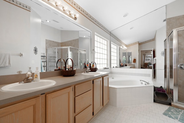 bathroom featuring tile patterned flooring, vanity, vaulted ceiling, and independent shower and bath