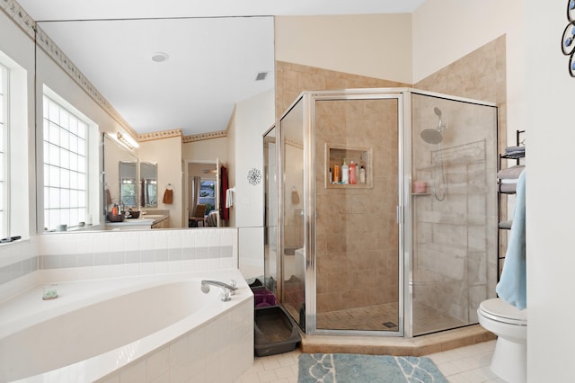 full bathroom with tile patterned flooring, shower with separate bathtub, toilet, and lofted ceiling