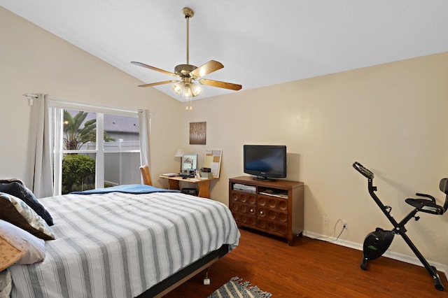 bedroom featuring dark hardwood / wood-style floors, ceiling fan, and lofted ceiling