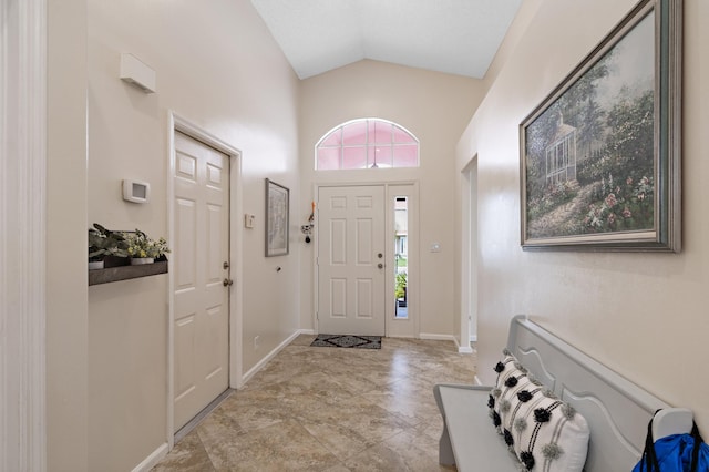 foyer entrance with lofted ceiling