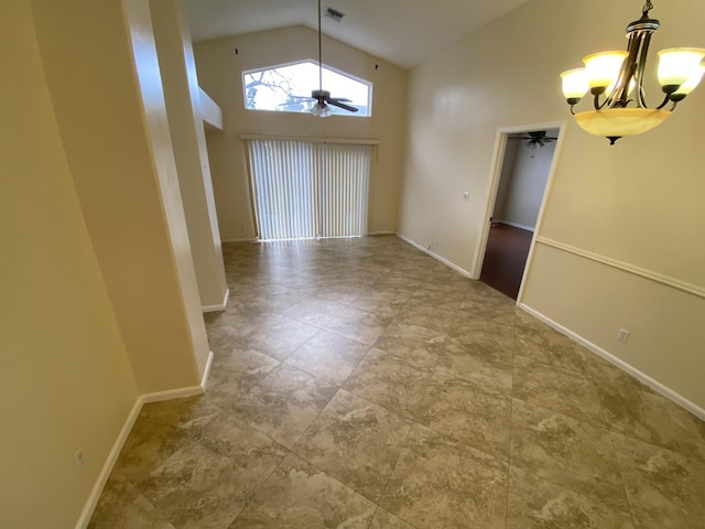 unfurnished dining area featuring high vaulted ceiling and ceiling fan with notable chandelier