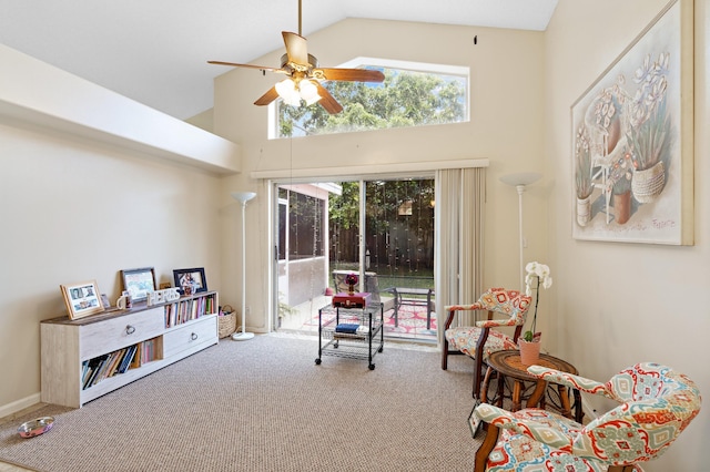 sitting room featuring ceiling fan, carpet, a healthy amount of sunlight, and high vaulted ceiling