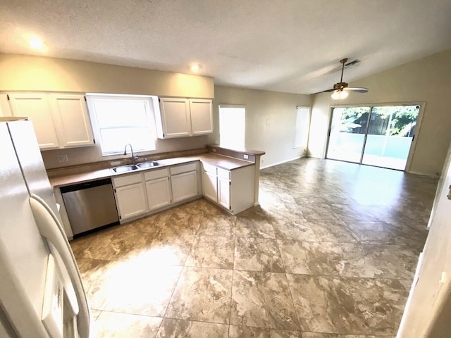 kitchen featuring a textured ceiling, sink, white refrigerator, dishwasher, and white cabinetry