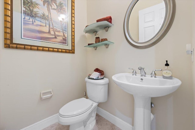 bathroom with sink and toilet