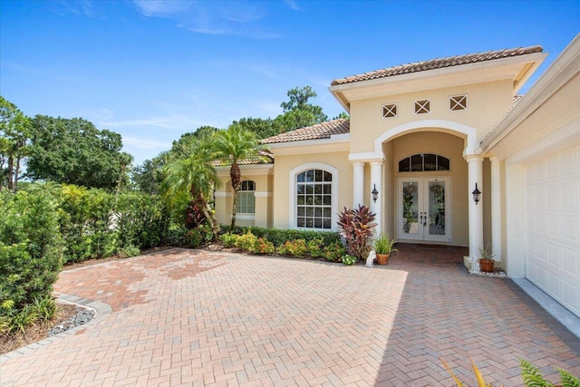 entrance to property featuring french doors