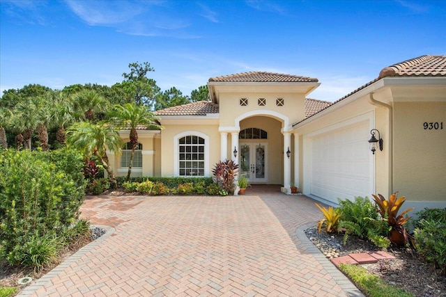 view of front of house featuring french doors and a garage