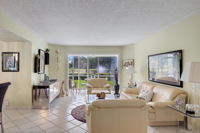 living room with light tile patterned floors and a textured ceiling